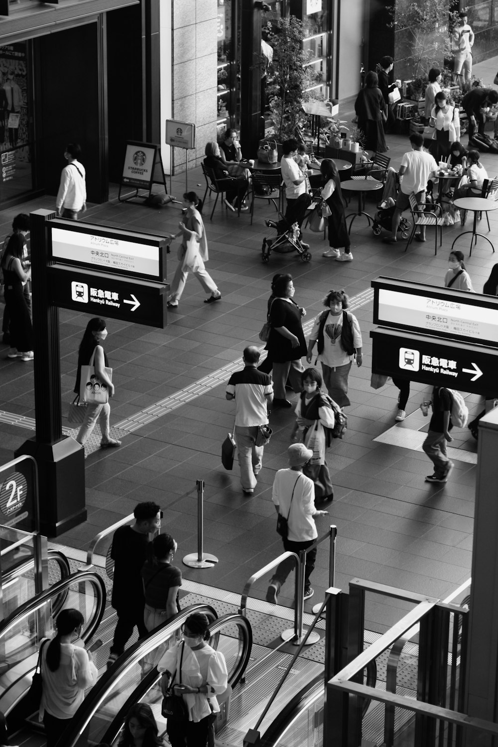 a black and white photo of people at an airport