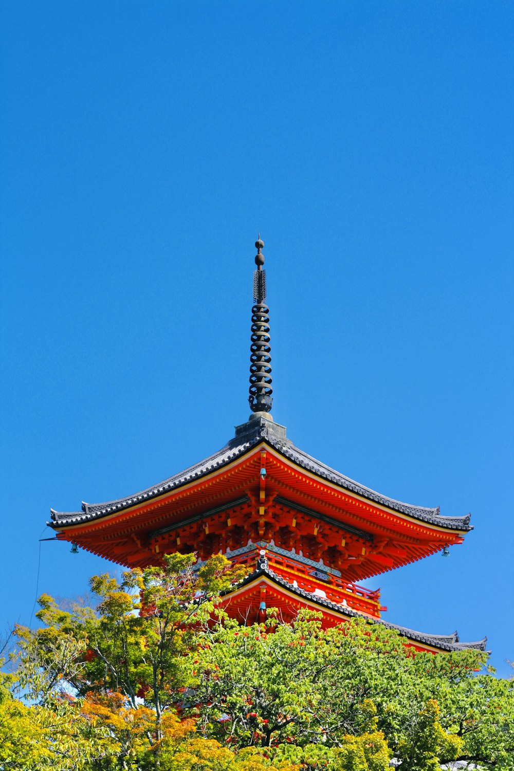 a tall red building with a tall tower on top of it