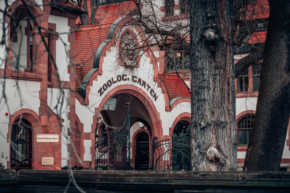 a red and white building with a clock on it