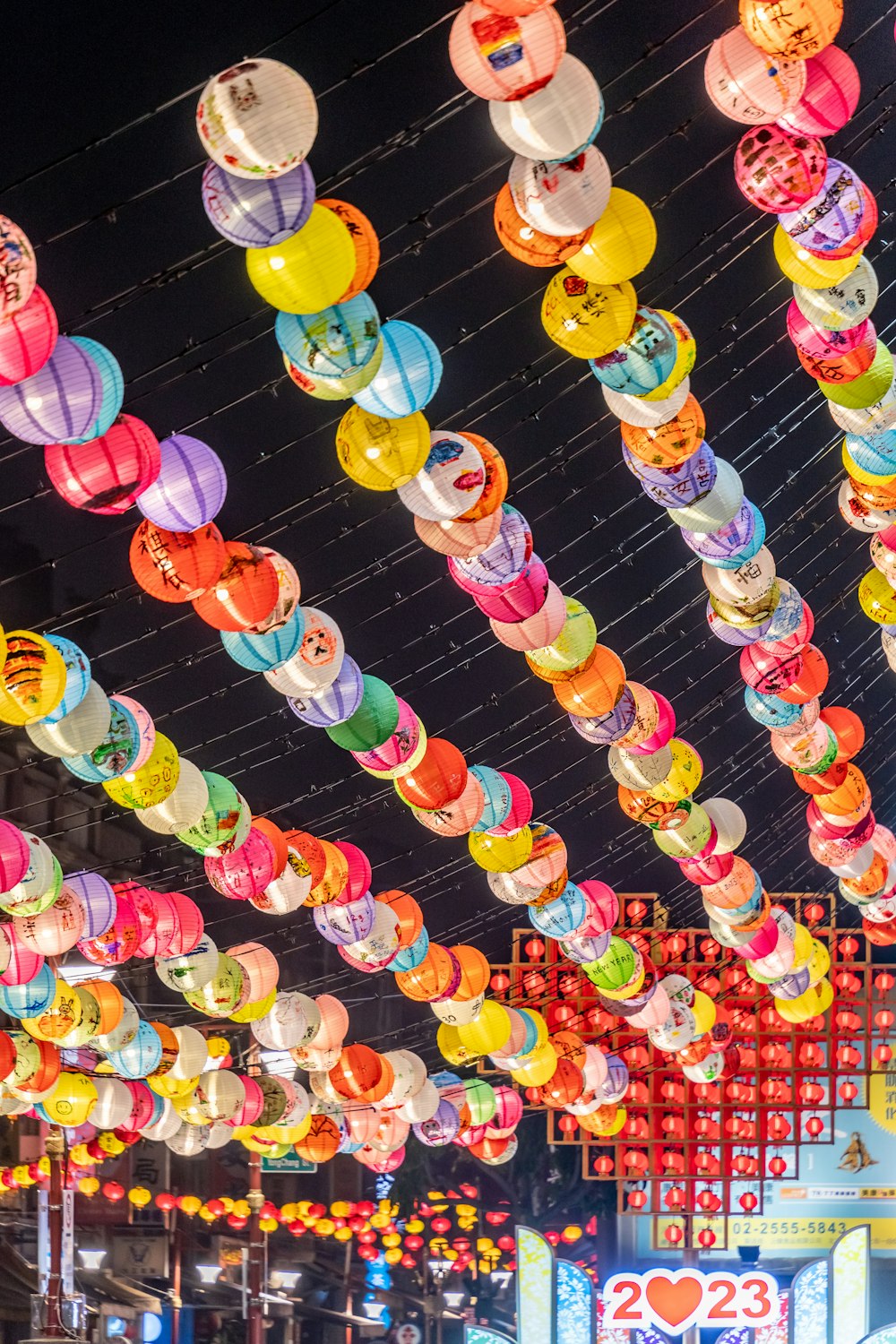 a large number of colorful lights hanging from the ceiling