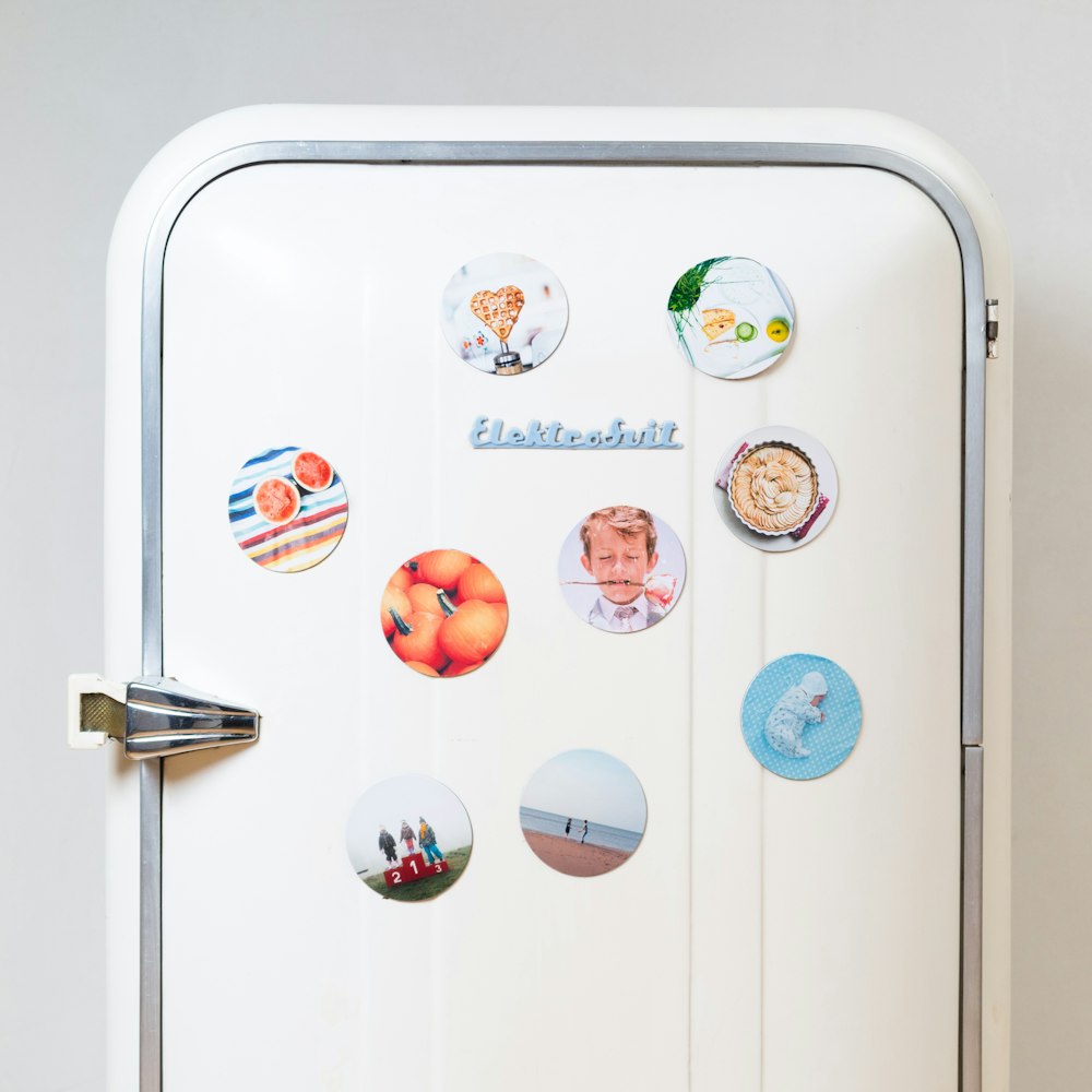 a refrigerator with a bunch of magnets on it