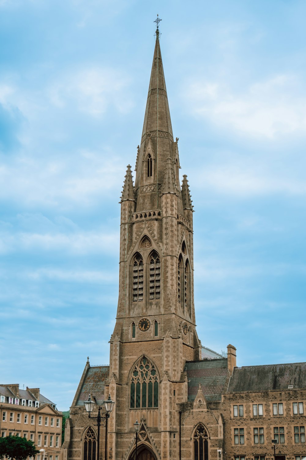 a very tall building with a clock on it's side