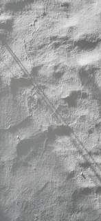 A living room wall featuring a warm, textured paint finish that adds depth and character.