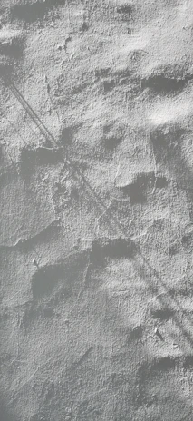 A living room wall featuring a warm, textured paint finish that adds depth and character.