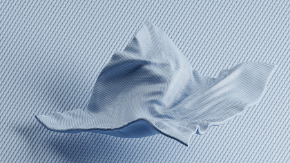 a white flower on a blue background