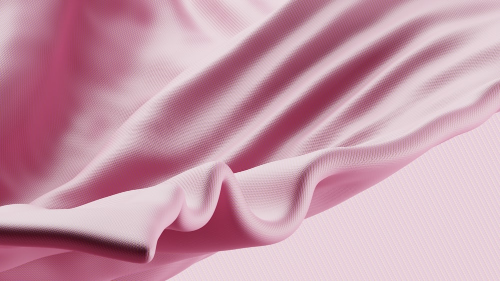 um close up de um tecido rosa em um fundo rosa