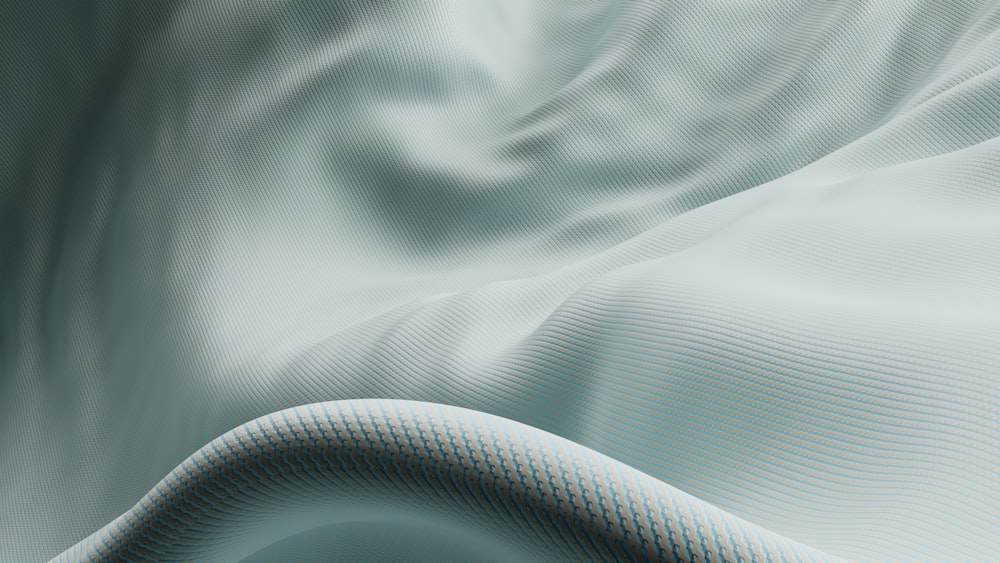 a close up of a white fabric with wavy lines