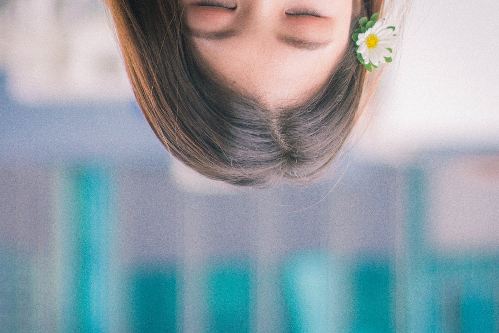 a woman with a flower in her hair