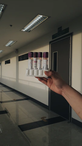 Close-up of high-purity peptides in labeled vials arranged neatly on a lab bench.