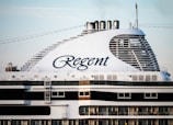 a large cruise ship with the word regent on it's side