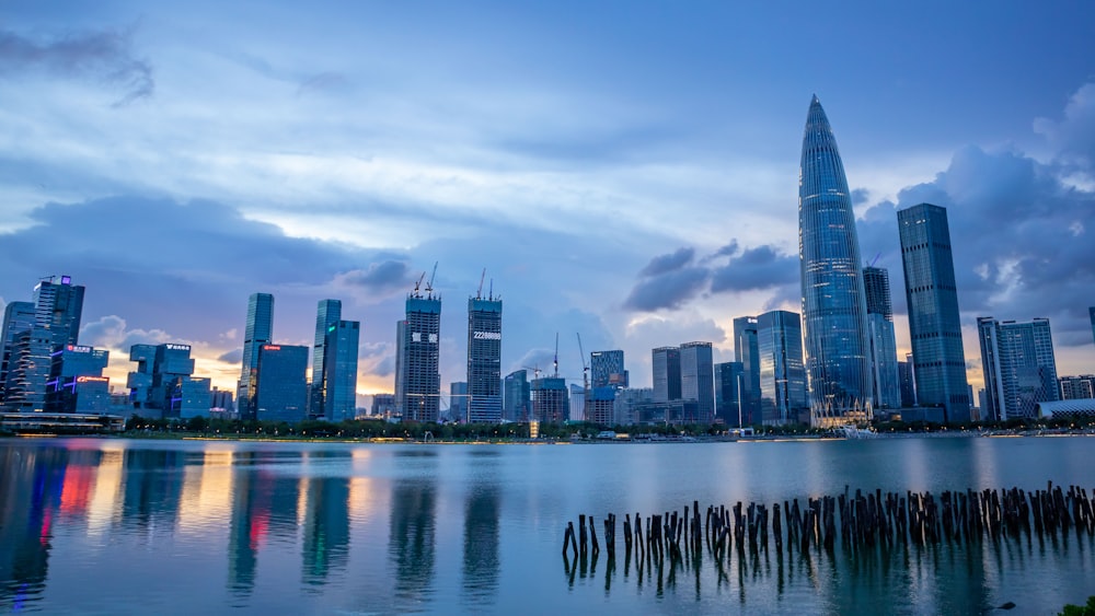 a large body of water with a city in the background