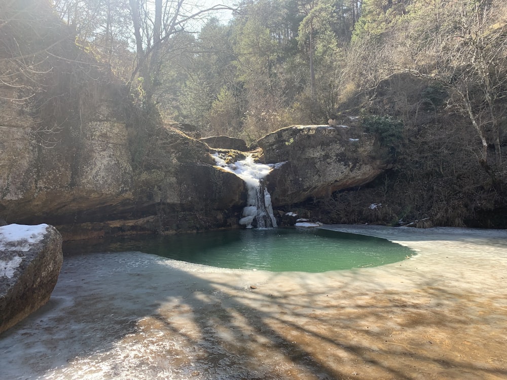 a small waterfall in the middle of a river