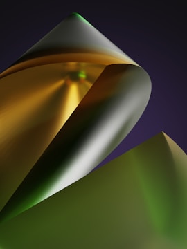 Abstract silver and gold shapes converging into a radiant core on black backdrop.