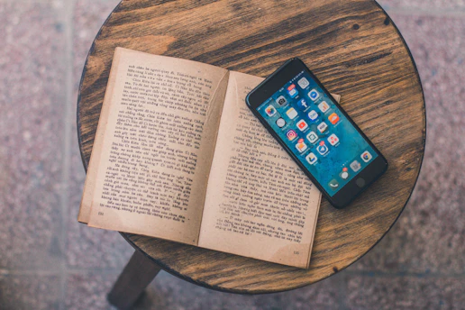an open book sitting on top of a wooden table