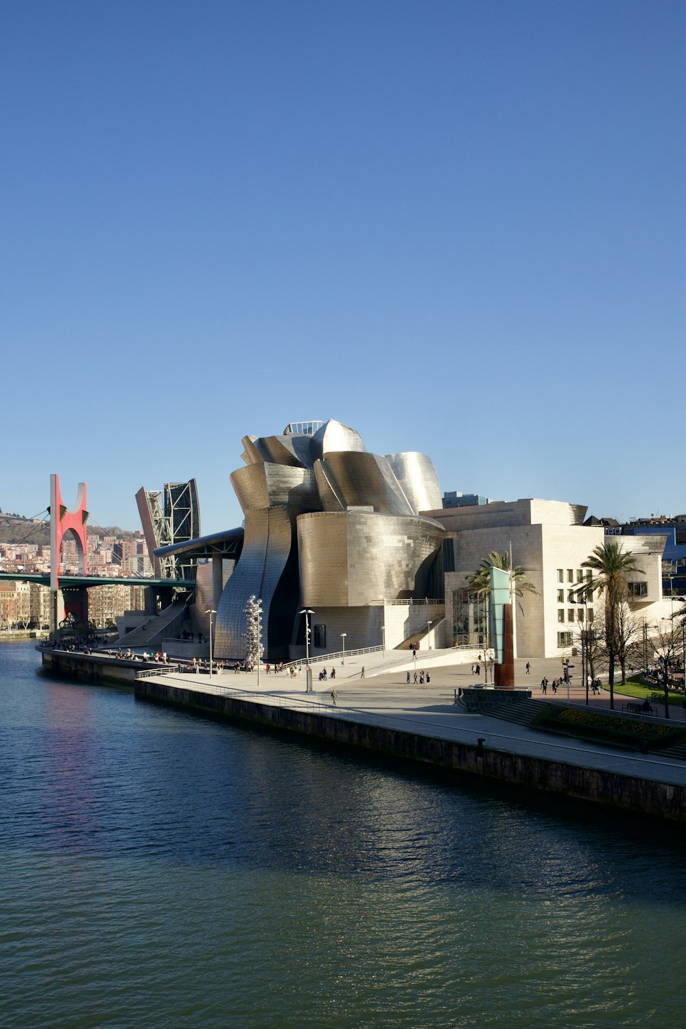 a large building on the side of a body of water