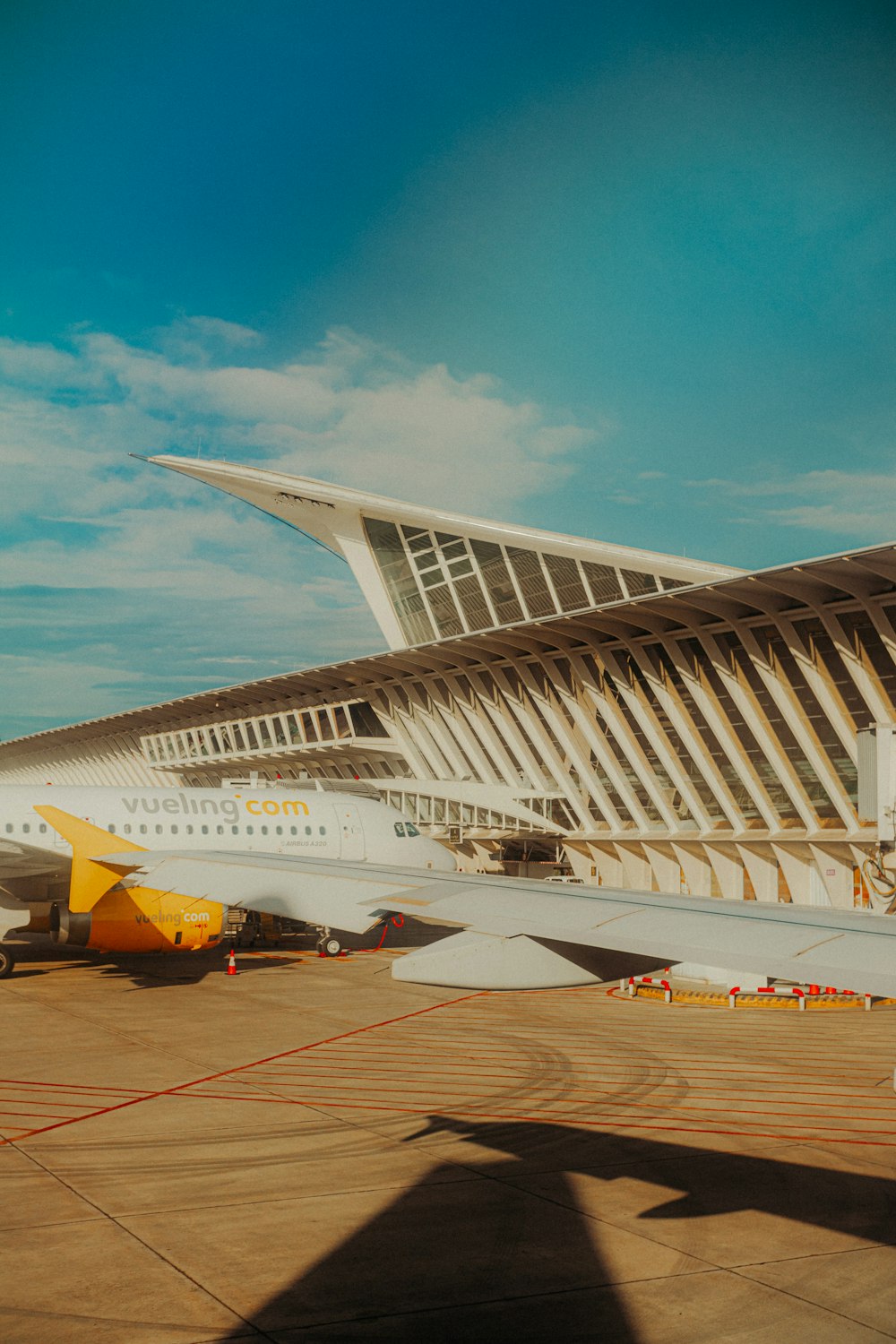 a large passenger jet sitting on top of an airport tarmac