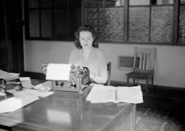 A professional sending out press releases from a modern office setting