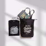 a pair of scissors and a book in a bag