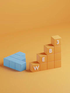 a blue block sitting on top of a yellow block
