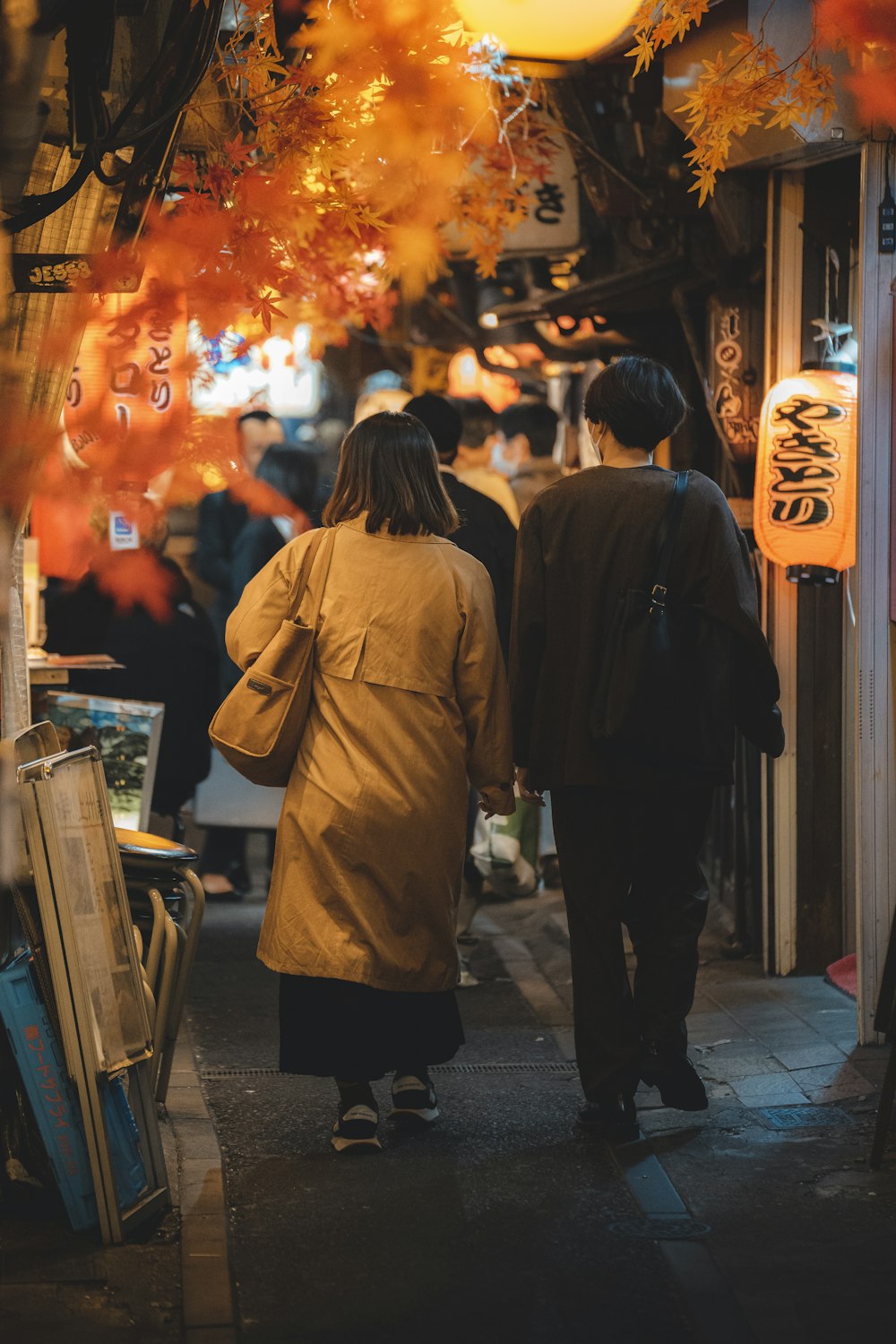 a man and a woman walking down a street