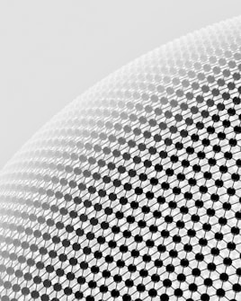 A close-up view of a geometric pattern consisting of black spherical nodes connected by thin lines, forming a lattice structure on a curved surface. The background is a light gray gradient.