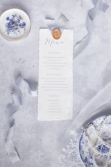 Close-up of beautifully printed disposable food packaging and elegant menu covers.