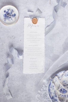 Close-up of beautifully printed disposable food packaging and elegant menu covers.