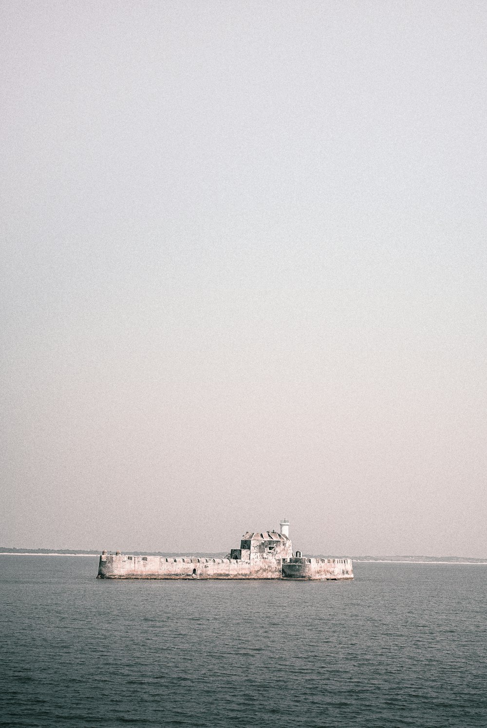 a large boat floating on top of a large body of water