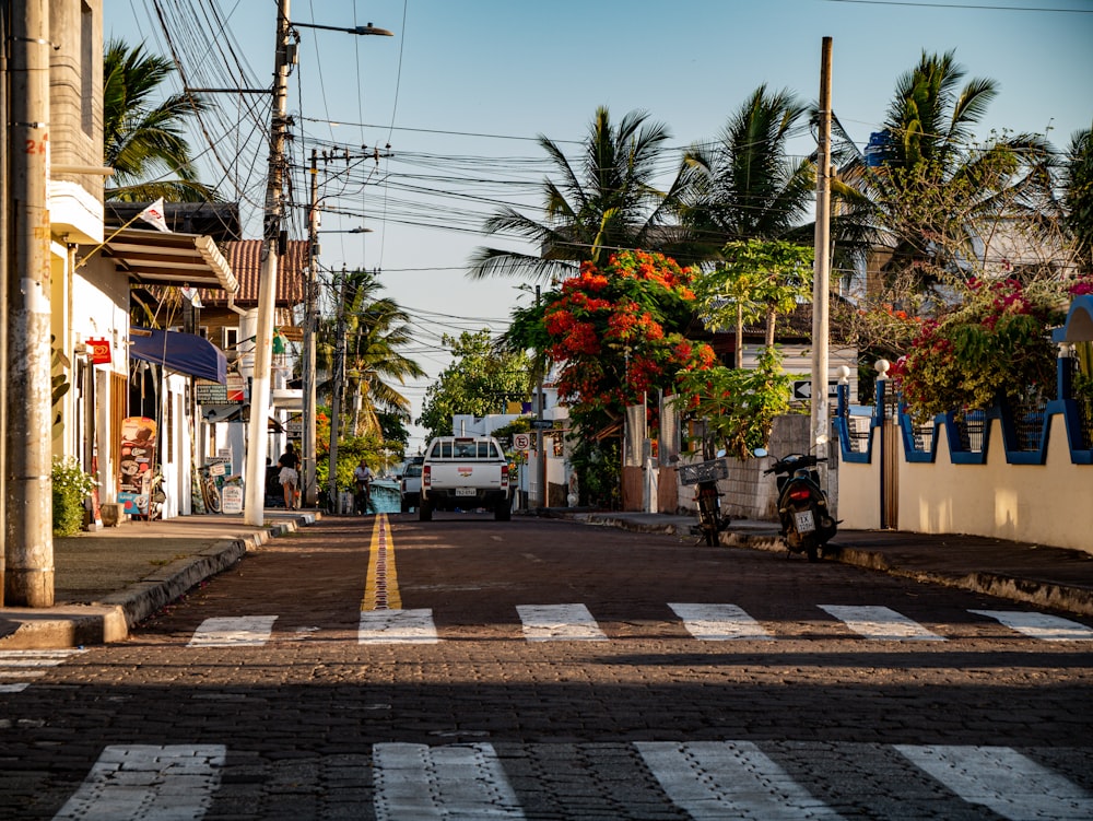 a street with a car parked on the side of it