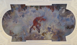 A large, vibrant painting of a swirling sky filled with rich blues and golds, capturing Gaetano Siniscalchi's signature celestial theme.