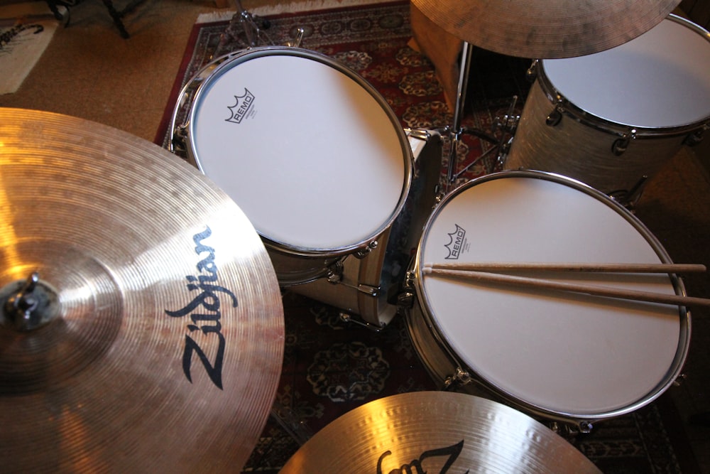 a group of drums sitting on top of a rug