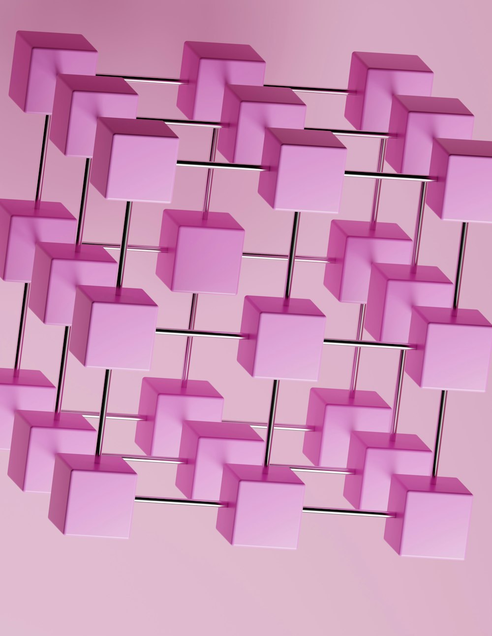 Un bouquet de cubes roses suspendus à un mur rose