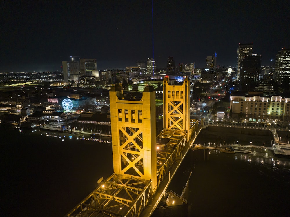 a view of a city at night from the top of a bridge