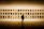 Visitor quietly admiring a large-format black and white abstract painting in a serene gallery setting.