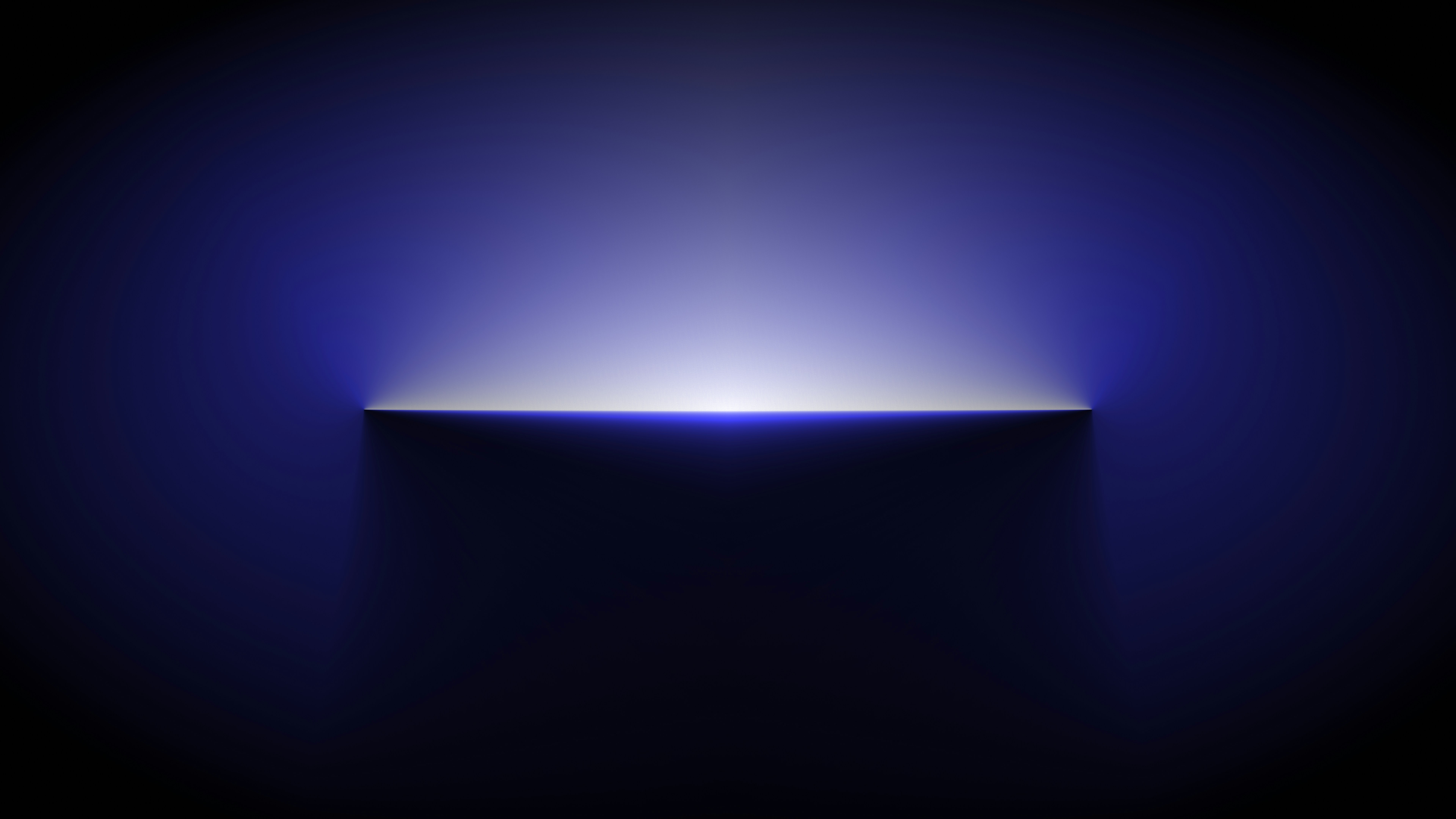 a dark room with a blue light coming out of it