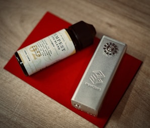 Close-up of a 2ml disposable e-cigarette with a matte finish resting on a wooden surface