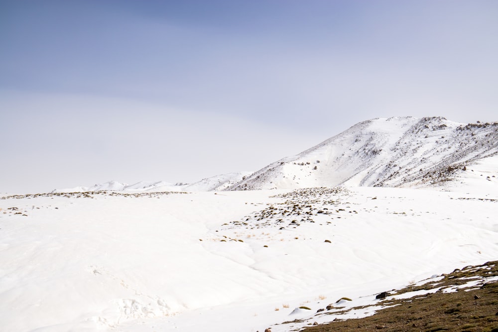 a snow covered mountain with a sky background