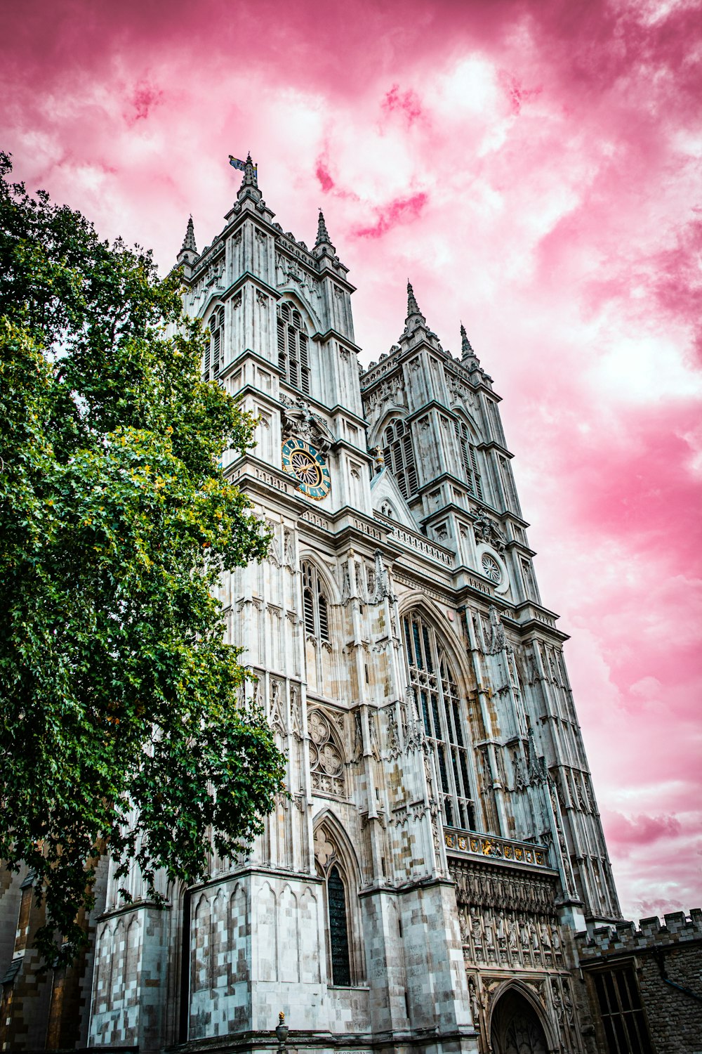 a large cathedral with a pink sky in the background