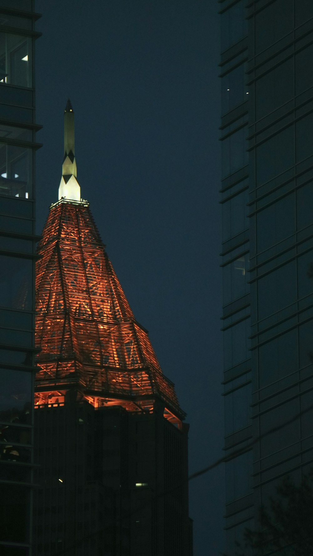 a very tall building with a clock on it's side