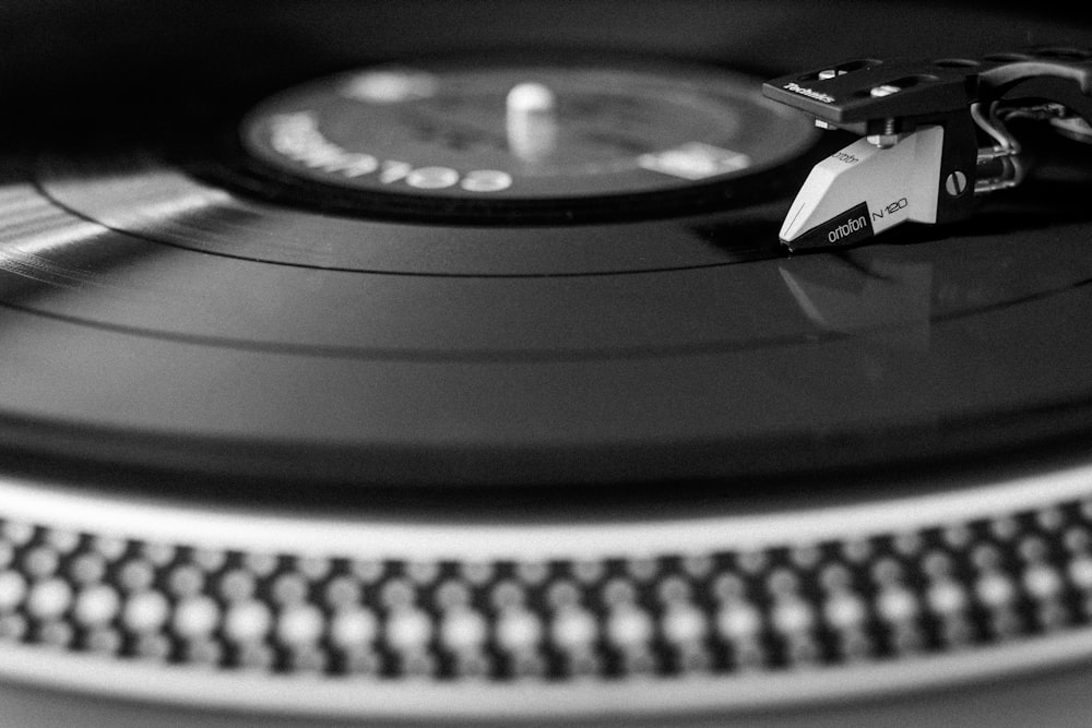 a black and white photo of a record player