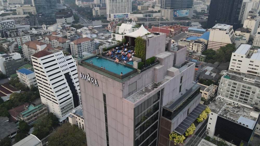a group of people sitting on top of a building