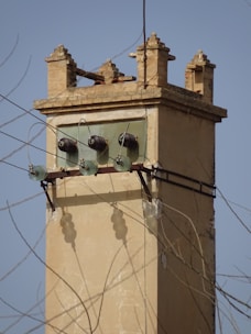 a tall tower with a clock on the top of it