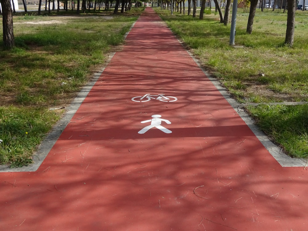 a bike path with a person walking down it
