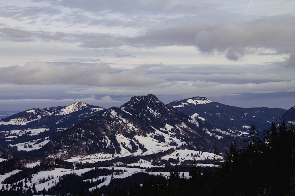 a view of a mountain range covered in snow