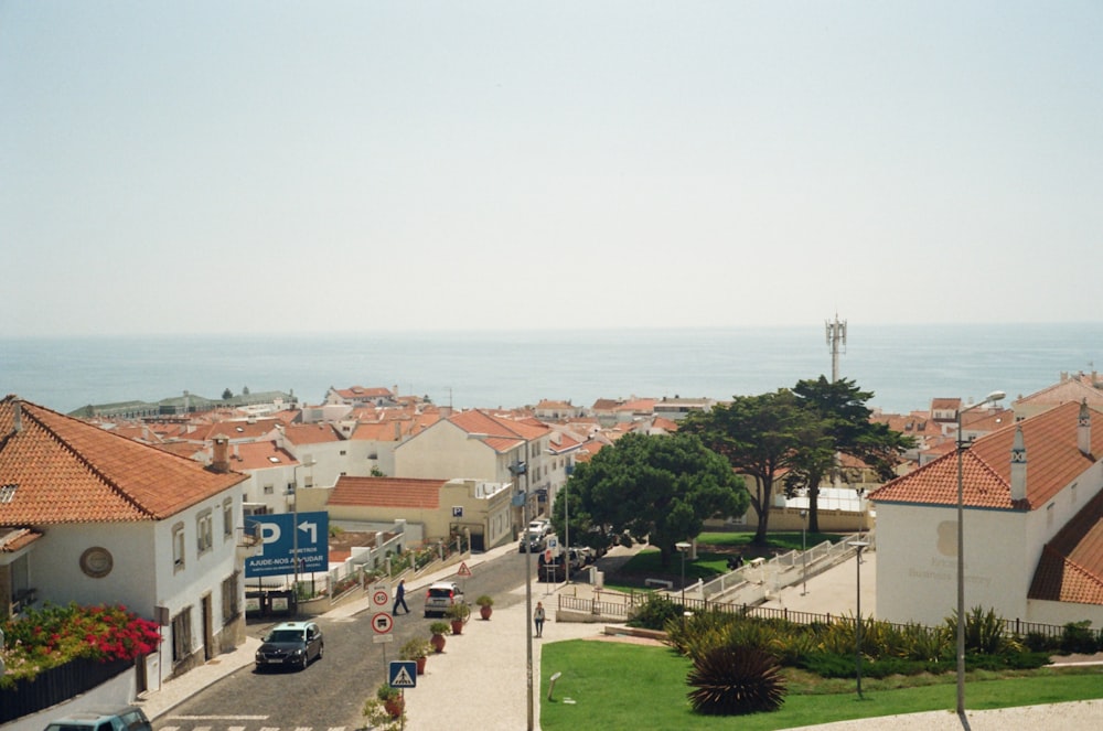 a view of a town with a beach in the background