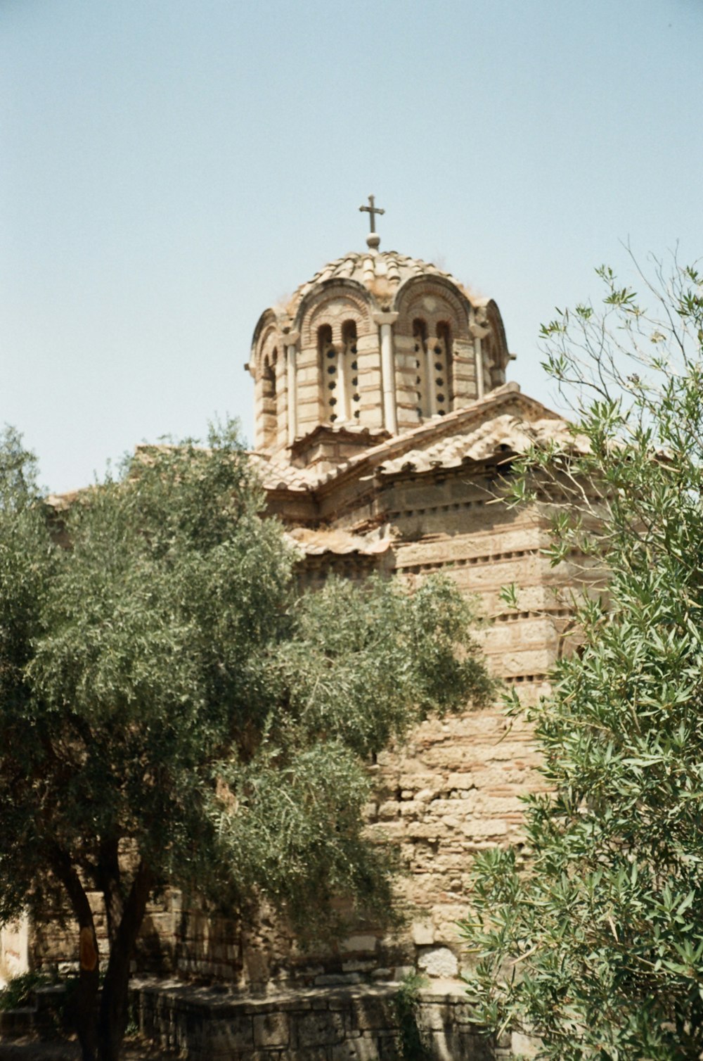 an old building with a cross on top of it