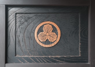 A set of elegant wooden plaques featuring detailed laser-etched company emblems.
