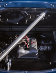 Close-up of a car's electrical wiring harness being inspected.