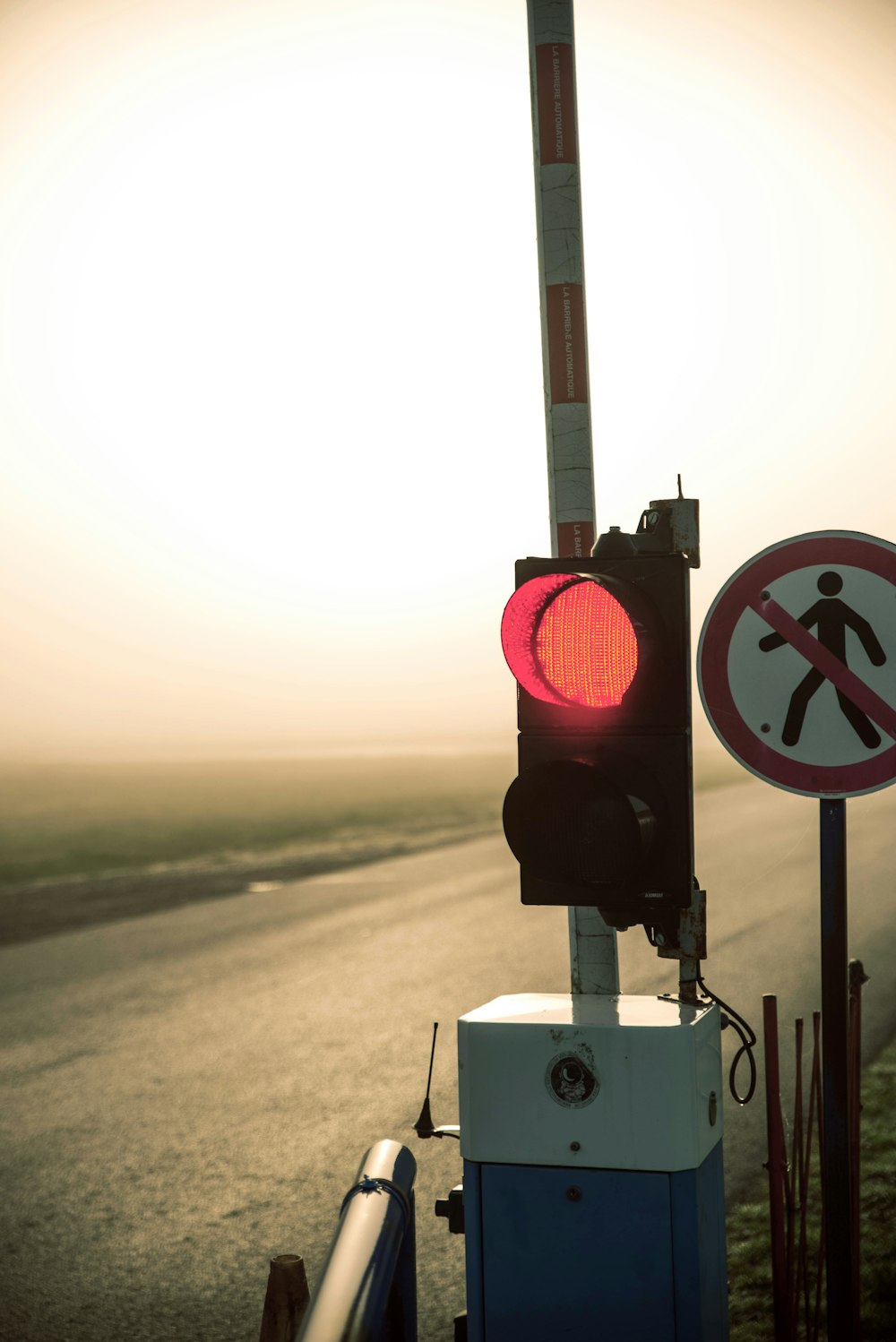 a traffic light with a no walking sign next to it