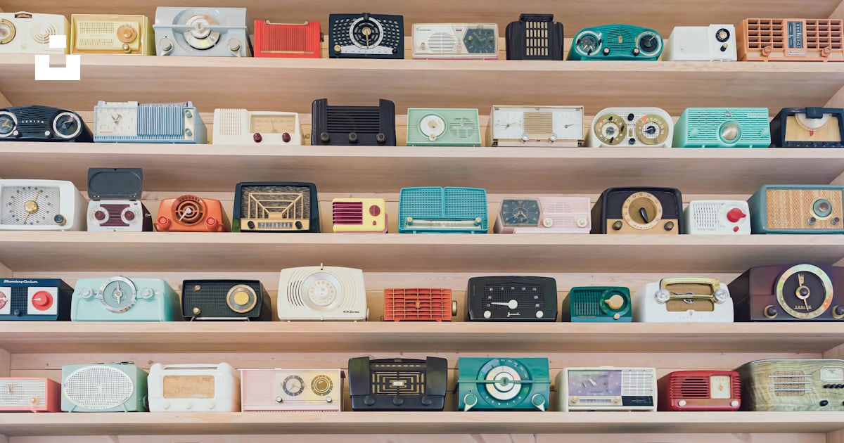A shelf filled with lots of different types of radio's photo – Free ...